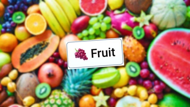 Infinite Craft Fruit block atop a blurred image featuring colorful fruits