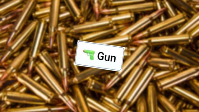 Infinite Craft Gun block atop a blurred image of shining golden-colored bullets