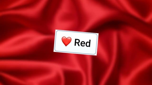 Infinite Craft Red block atop a blurred backdrop showing red-colored wrinkled silk sheets